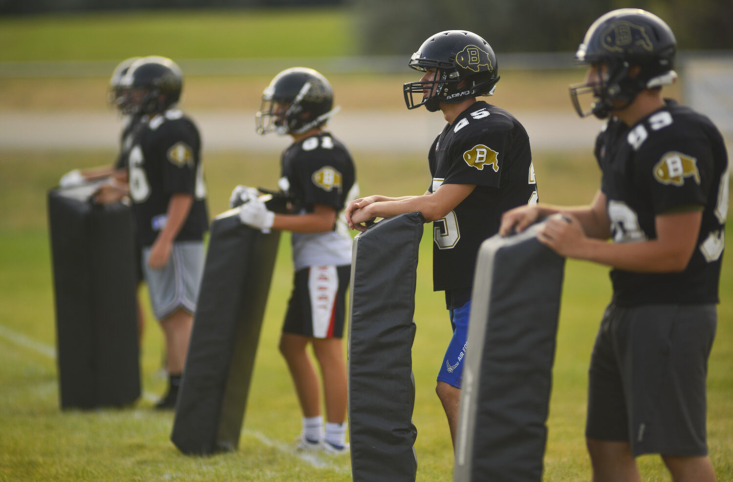 Buffalo players await the incoming group of players during the team drill